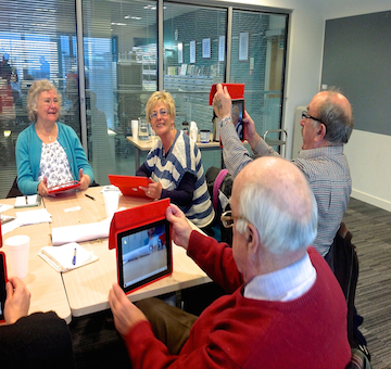 Participants learning how to create their digital stories using tablet technology.